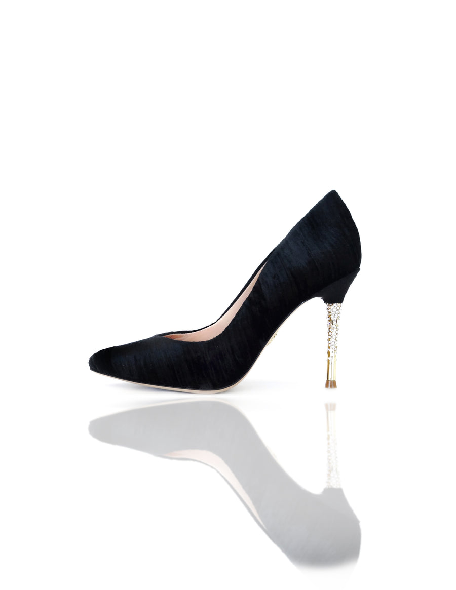Nadia is a pointed toe pump with an opulent heel featuring clusters of Swarovski crystals that glitter while you walk. A rubber pod is recessed into the outsole to prevent slips. 4" or 100mm gold metal heel.